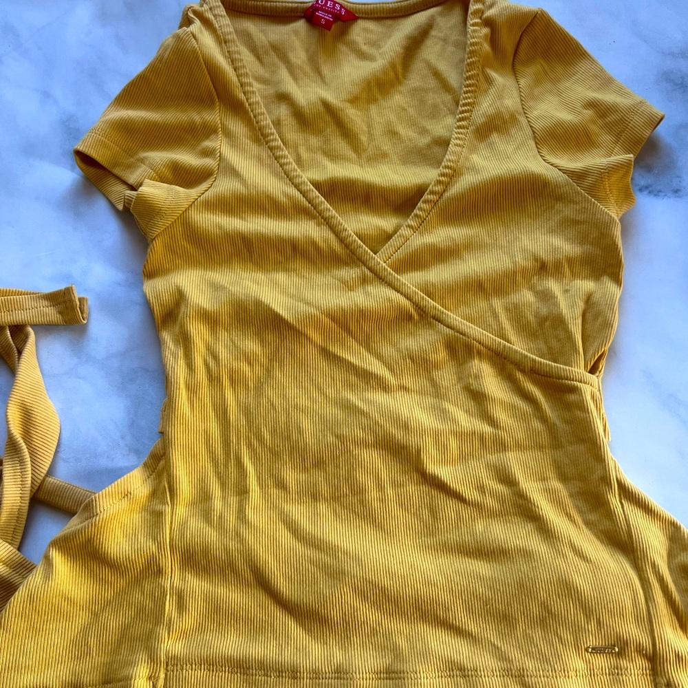 Worn once, super cute, nice material, fits body nice, feels soft shirt.